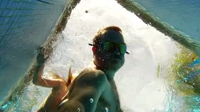 LOS CABOS MEXICO-2020: Middle Age Man Being Pulled Up By A Woman In The Pool