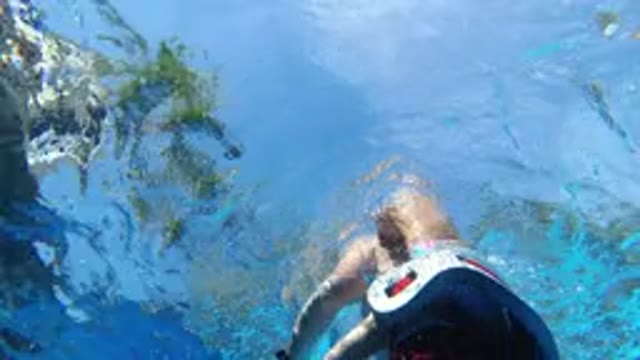 LOS CABOS MEXICO-2020: An Adult And A Kid Having Fun Swimming In The Water