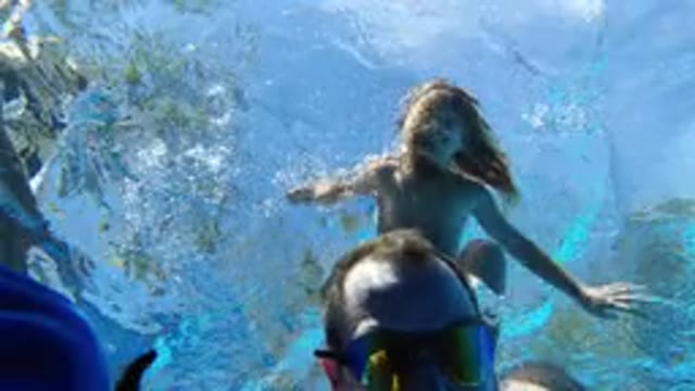 LOS CABOS MEXICO-2020: Two People Playing In A Pool During The Day While A