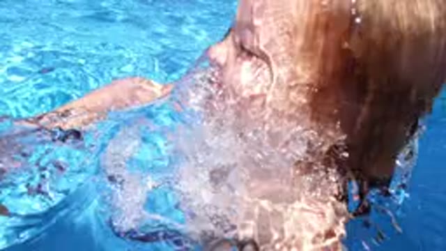 LOS CABOS MEXICO-2020: A Kid Is Playing In The Pool On A Sunny Day