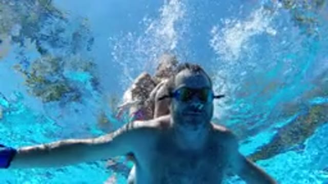 LOS CABOS MEXICO-2020: A Couple Swimming In A Pool And Having Fun