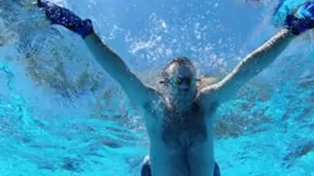 LOS CABOS MEXICO-2020: Man And Son Swimming Together And Having Fun In The Pool