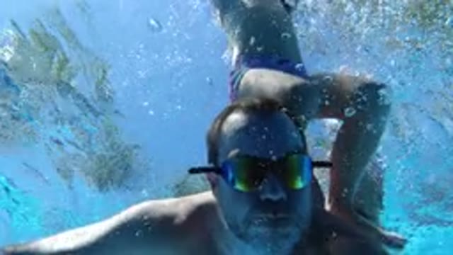 LOS CABOS MEXICO-2020: A Man Dives Underwater With His Son