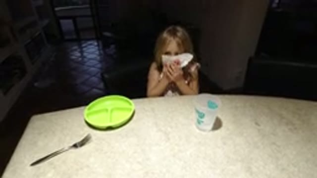 LOS CABOS MEXICO-2020: Little Blonde Girl Being Playful At Dining Table