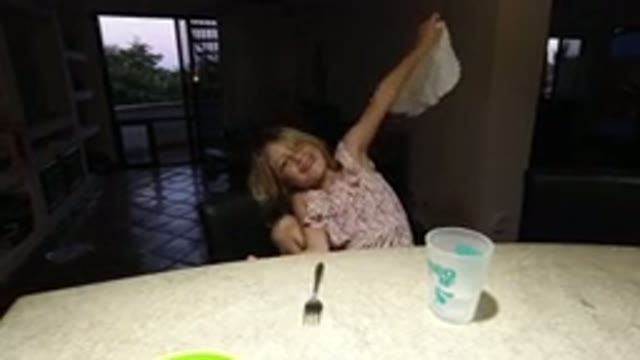 LOS CABOS MEXICO-2020: A Child Sitting at a Table Holding a Napkin