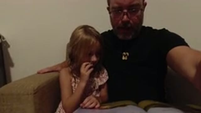 LOS CABOS MEXICO-2020: Father Reading A Book To His Daughter