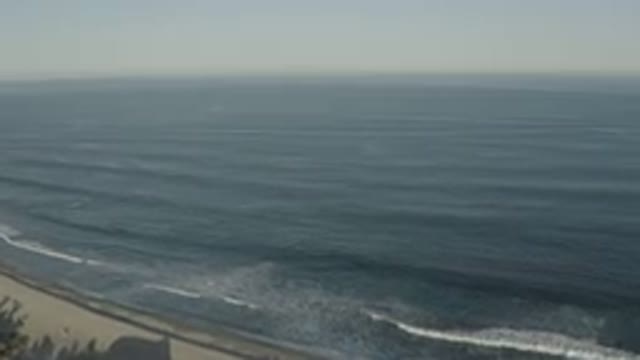 LOS CABOS MEXICO-2020: A Wide View Of A Dark Blue Sea Water And Beach With White