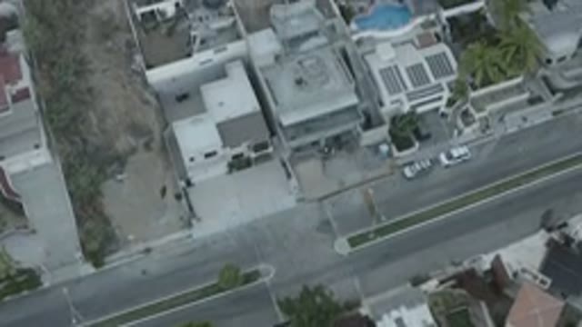 LOS CABOS MEXICO-2020: Overhead Footage Of A Neighborhood With Houses Pools Cars