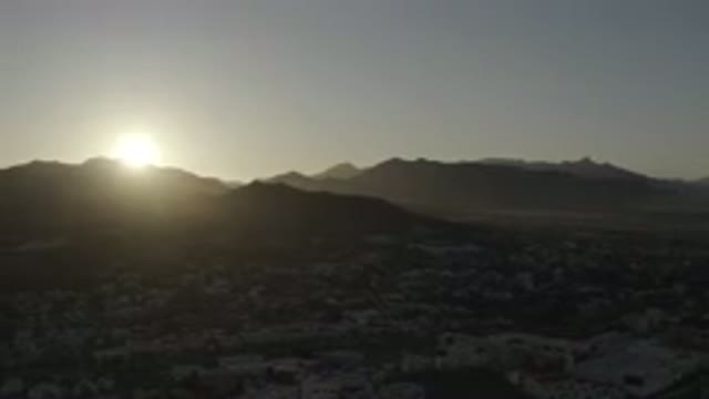 LOS CABOS MEXICO-2020: The Sun Is Setting Behind The Calm Mountains And Blue