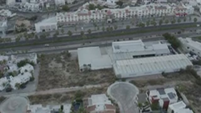 LOS CABOS MEXICO-2020: Slow Upwards Shot Of Cars Passing Through Street In