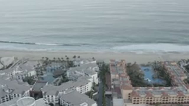LOS CABOS MEXICO-2020: Beachfront Apartments Line Shore With Waves Rolling In
