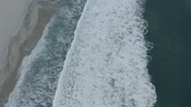 LOS CABOS MEXICO-2020: Waves Breaking On A Beach Drone Shot