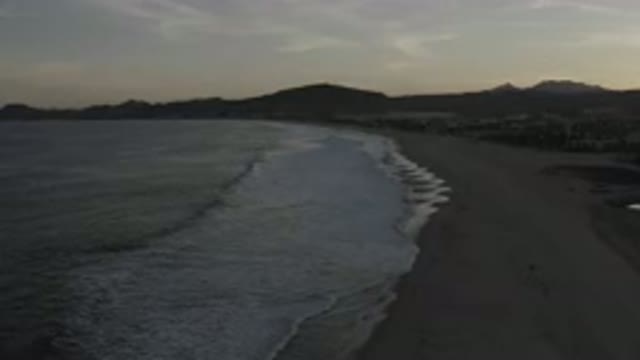 LOS CABOS MEXICO-2020: Side View Of A Beach With Calm White Bubbled Waves