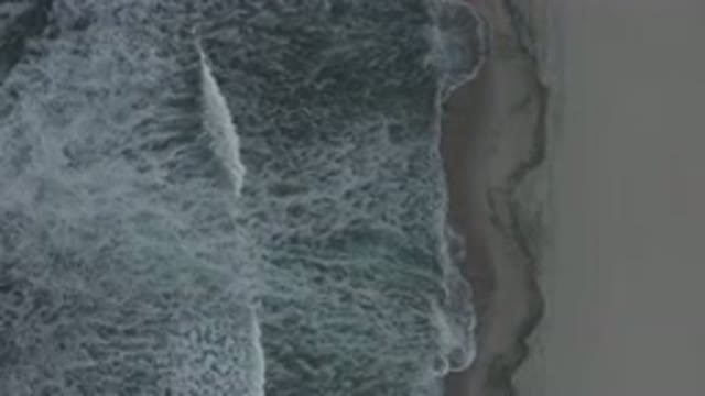 LOS CABOS MEXICO-2020: Bird's-Eye View Of A Beach With Waves Moving Toward The