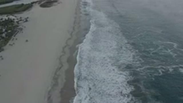 LOS CABOS MEXICO-2020: Beach Hit With Waves During A Cloudy Day With Trees