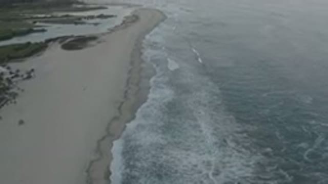LOS CABOS MEXICO-2020: Topside View Of A Long Beach With Wide Sand And White Waves