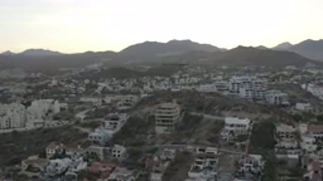 LOS CABOS MEXICO-2020: Drone Shot Over Houses And Buildings As The Sun Is Rising