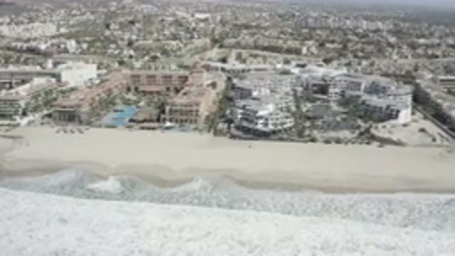 SAN JOSE DEL CABO MEXICO-2020: Waves Crashing On The Beach Near A Beach Town