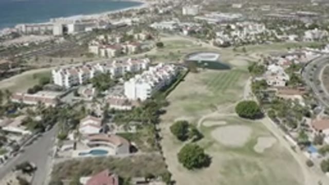 SAN JOSE DEL CABO MEXICO-2020: Aerial View Of A Summer City With Green Fields And Hills