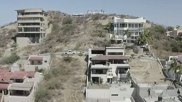 SAN JOSE DEL CABO MEXICO-2020: House Buildings Dry Vegetation Trees Cars On The Street