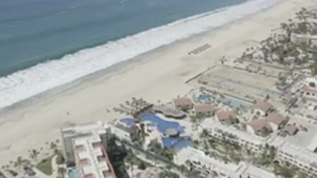 SAN JOSE DEL CABO MEXICO-2020: Beach River Or Sea Buildings Trees Small Houses
