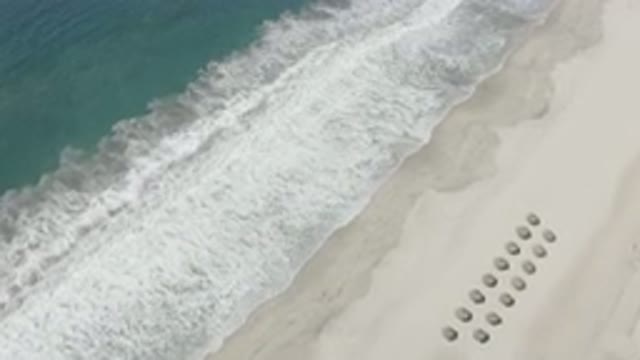 SAN JOSE DEL CABO MEXICO-2020: Drone Shot Of A Wave Breaking On A Sand Beach