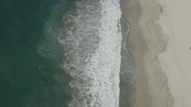 SAN JOSE DEL CABO MEXICO-2020: Gorgeous Sea Water Waving At Seashore Sand Land