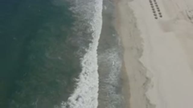 SAN JOSE DEL CABO MEXICO-2020: Aerial Footage Of An Ocean Shoreline On A Sandy Beach