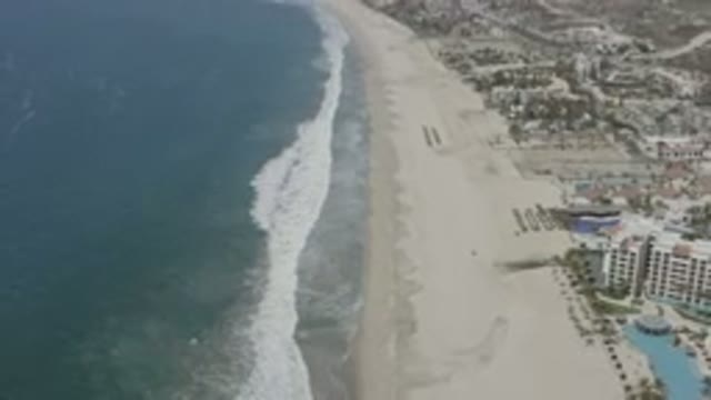 SAN JOSE DEL CABO MEXICO-2020: Waves Rolling In Slowly On The Sandy Shores Of