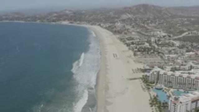 SAN JOSE DEL CABO MEXICO-2020: Sandy Beach in Populated Tourist Mountainous Area