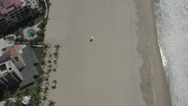 SAN JOSE DEL CABO MEXICO-2020: Aerial View Of Hotels On Empty Beach With Waves