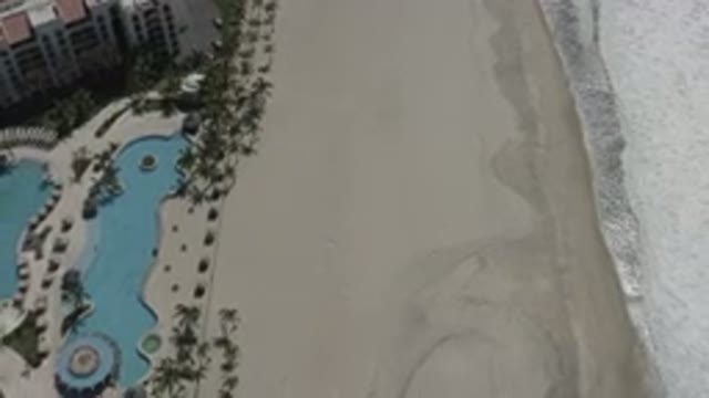 SAN JOSE DEL CABO MEXICO-2020: Drone Footage Of Waves Slowly Crashing Onto Sand