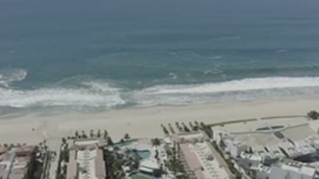 SAN JOSE DEL CABO MEXICO-2020: A Blue Sea And Beach View Over The Buildings