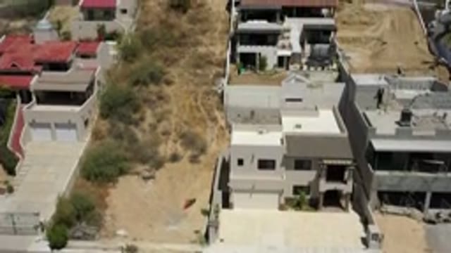 SAN JOSE DEL CABO MEXICO-2020: A Hilltop View Of Buildings And Distant Landmarks