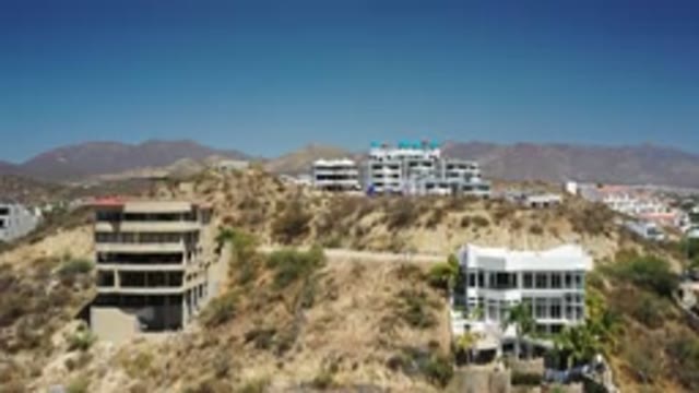 SAN JOSE DEL CABO MEXICO-2020: A Hill Top View Of Two Buildings On Next Hill And