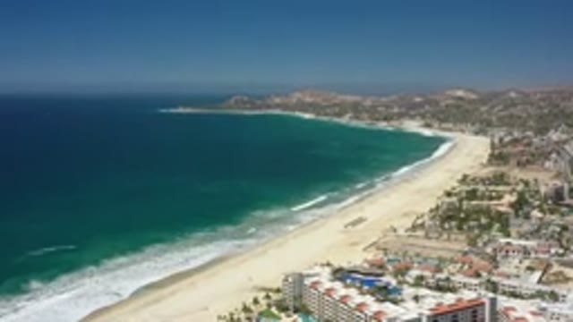 SAN JOSE DEL CABO MEXICO-2020: A Wide View Of A Blue Green Sea And A City With