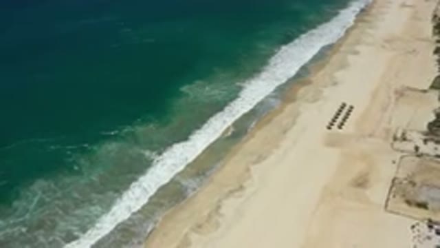 SAN JOSE DEL CABO MEXICO-2020: Drone Shot Of A Wave Breaking On A Sandy Beach