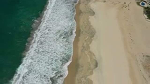 SAN JOSE DEL CABO MEXICO-2020: Waves From The Green Sea In The Beach