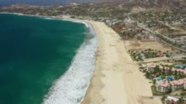 SAN JOSE DEL CABO MEXICO-2020: Blue Sea Tides Wave Near City Houses And Sky