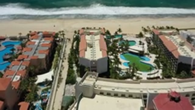 SAN JOSE DEL CABO MEXICO-2020: Beautiful Beach Resort Buildings With Grass And Palm Trees