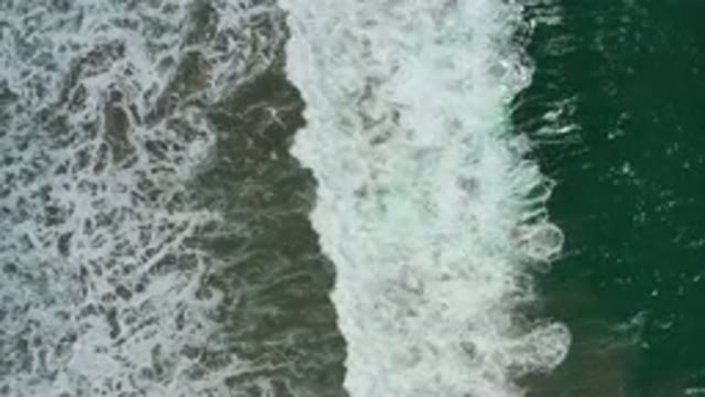 SAN JOSE DEL CABO MEXICO-2020: A Top View Of A Bubble Wave On A Beach