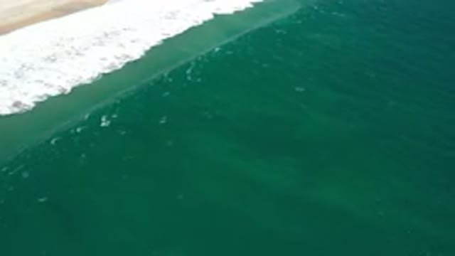 SAN JOSE DEL CABO MEXICO-2020: Aerial View Of A Small Wave In A Green Sea