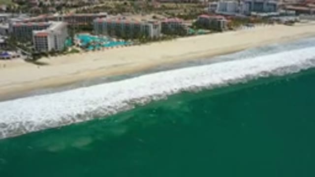 SAN JOSE DEL CABO MEXICO-2020: Clear Waves Crash Against Sunny Beach Front At