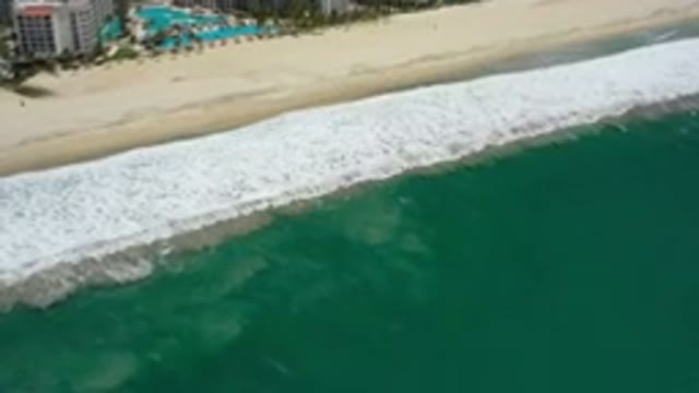 SAN JOSE DEL CABO MEXICO-2020: Empty Beach With Smooth Waves Breaking White Foam