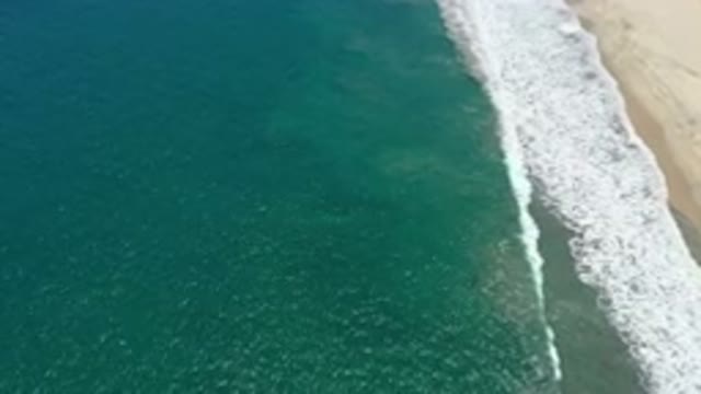 SAN JOSE DEL CABO MEXICO-2020: Aerial View Of Tiny Calm Waves At The Shore