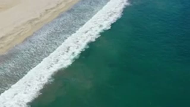 SAN JOSE DEL CABO MEXICO-2020: Top View Of A White Bubble Sea Wave In A Beach