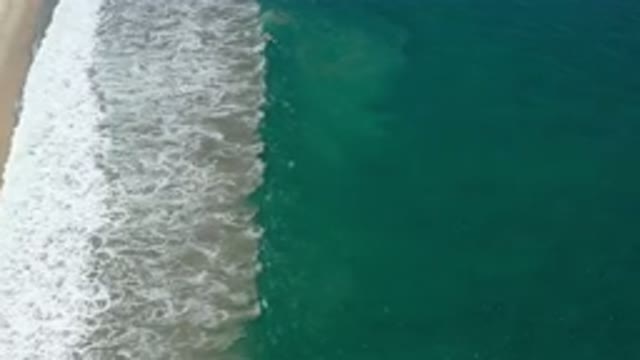 SAN JOSE DEL CABO MEXICO-2020: A Green Deep And A Wide White Bubble Wave On A
