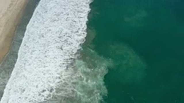 SAN JOSE DEL CABO MEXICO-2020: A Green Deep Seashore And Wide White Bubble Waves