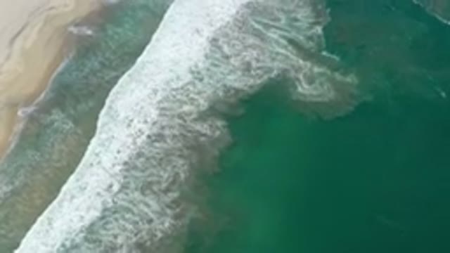 SAN JOSE DEL CABO MEXICO-2020: Teal Ocean Water At Beach Rolling In As Waves