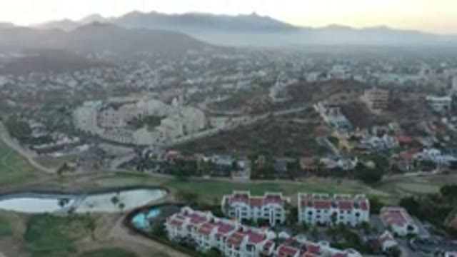 SAN JOSE DEL CABO MEXICO-2020: Aerial View Panning Up And Over Homes And